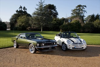 1968 Ford Mustang with 2006 Mini Cooper convertible. Creator: Unknown.