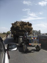 Tractor loaded with sugar cane, Uttarakhand, India. Creator: Unknown.