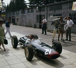 Lola Coventry Climax, Chris Amon being filmed 1963 German grand Prix. Creator: Unknown.