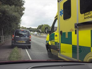 Ambulance attending road traffic accident, A35 Hampshire 2017. Creator: Unknown.