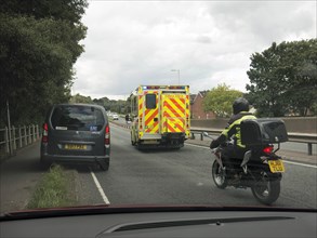Ambulance attending road traffic accident, A35 Hampshire 2017. Creator: Unknown.