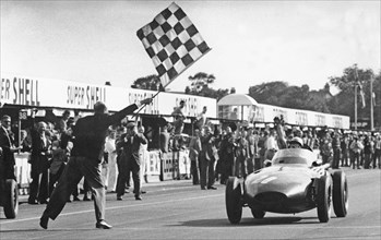 Stirling Moss winning 1957 British Grand Prix at Aintree in the Vanwall. Creator: Unknown.
