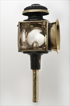 Candle powered carriage lamp 1900. Creator: Unknown.