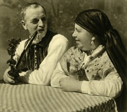 Couple in traditional dress, Upper Austria, c1935.  Creator: Unknown.