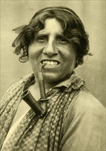 Gipsy woman smoking a pipe, Burgenland, Austria, c1935. Creator: Unknown.