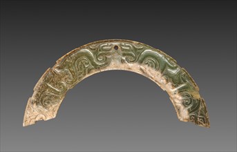 Arc-shaped Pendant with Animal Mask and Interlaced Animal Bands (Huang), 300-100 BC. Creator: Unknown.