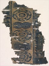 Brocaded silk fragment with running animal roundels and kufic inscriptions, 1530-1950. Creator: Unknown.
