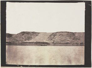 General View of Monuments Carved into Bedrock with Photographer's Dahabieh. Abu Simbel, 1851-1852. Creator: Félix Teynard (French, 1817-1892).