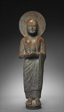 Standing Disciple Mahakasyapa Holding a Cylindrical Reliquary, c. 550. Creator: Unknown.