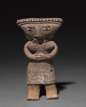 Standing figurine holding an animal (dog?), 300 B.C. to A.D. 300. Creator: Unknown.