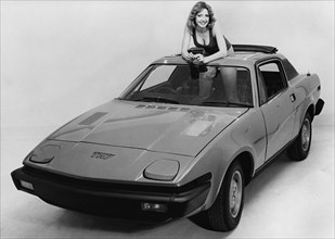 1976 Triumph TR7 with female model. Creator: Unknown.