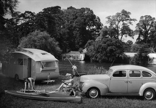 1939 Ford V8-91 with caravan. Creator: Unknown.
