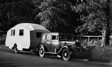1931 Morris Isis saloon with Winchester caravan. Creator: Unknown.