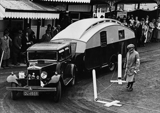 1930 Morris Oxford Six with Winchester Streamline caravan. Creator: Unknown.