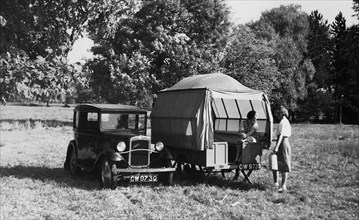 1930 Austin Seven with trailer caravan. Creator: Unknown.