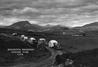 Group of cars and caravans camping in Scottish Highlands 1930's. Creator: Unknown.