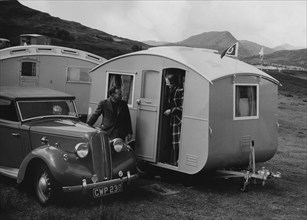 1939 Ausin Big Seven tourer with caravans. Creator: Unknown.