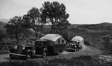 1936 Austin Twenty with caravan and 1936 Oldsmobile Eight with caravan. Creator: Unknown.