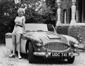 1957 Austin - Healey 100-6 with model. Creator: Unknown.