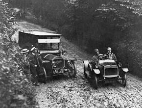 G.W.K passing Napier on very muddy track circa 1915. Creator: Unknown.