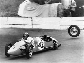 1954 Kieft 500cc at Crystal Palace, losing a wheel. Creator: Unknown.