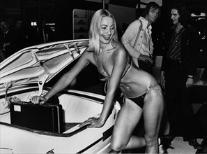 Female model in bikini at 1976 Motor Show, Earl's Court. Creator: Unknown.