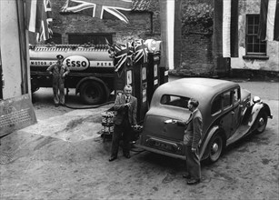 Esso garage at the end of petrol rationing 1950. Creator: Unknown.