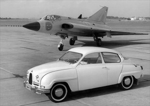 1960 Saab 96 and Saab 35 Draken Jet Fighter. Creator: Unknown.