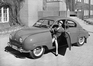 1954 Saab 92b with female model. Creator: Unknown.