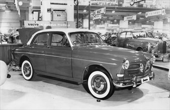 1956 Volvo 120 Amazon at motor show. Creator: Unknown.