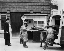 Volunteer stretcher party at Vauxhall factory, Wing Commander Hodsall, WW2.. Creator: Unknown.