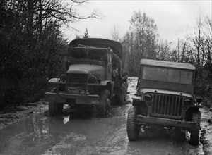 GMC 352 CCKW and Willys Jeep circa 1944. Creator: Unknown.