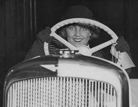 Female model in Hillman Minx at 1933 Motor Show. Creator: Unknown.