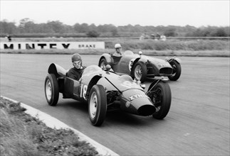Yimkin of D. Sim leads Lotus 7 of P.Warr at Silverstone 1960. Creator: Unknown.