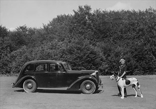 1938 Daimler DB18 with lady and her pet dog. Creator: Unknown.