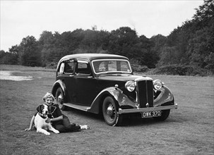 1938 Daimler DB18 with lady and her pet dog. Creator: Unknown.
