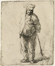 Ragged Peasant with his Hands behind Him, holding a Stick, c.1630. Creator: Rembrandt Harmensz van Rijn.
