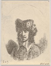 Plate 2: head of a man with a moustache and fur cap facing left, an oval composition, from..., 1650. Creator: Stefano della Bella.