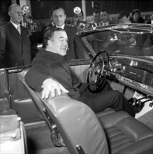 Prince Bertil tests a convertible Mercedes Benz at the car showroom in Stockholm, 1954. Creator: Unknown.