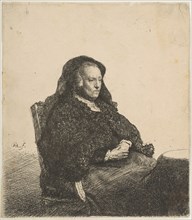 The Artist's Mother Seated at a Table Looking Right: Three-Quarter Length, ca. 1631. Creator: Rembrandt Harmensz van Rijn.