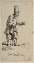 A Peasant in a High Cap, Standing Leaning on a Stick, 1639. Creator: Rembrandt Harmensz van Rijn.