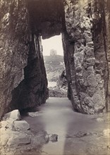 [View Through Rocks' Of Tower On Hill], 1870s.