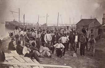 Laborers at Quartermaster's Wharf, Alexandria, Virginia, 1863-65. Formerly attributed to Mathew B. Brady.