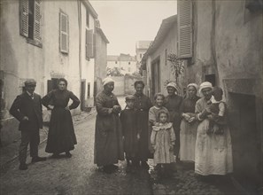 [Group of Adults and Children on a Village Street in the Auvergne], ca. 1910.