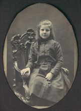 [Girl with Ringlets, Seated, Three-Quarter Length], 1890s.