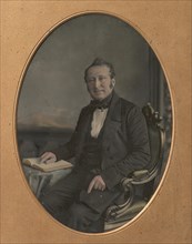 Seated Man Pointing to a Passage in an Open Book, 1850s.