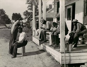 Haircutting in Front of General Store and Post Office on Marcella Plantation, Mileston, Mississippi, 1939.
