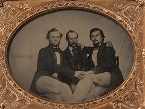Three Seated Men with Arms Around Each Other, 1860s.