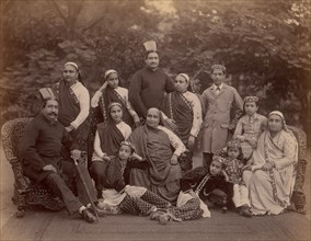 Formal Family Portrait of Thirteen People, Men in European Dress, 1860s-70s.