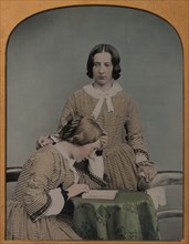 Two Women Wearing Striped Dresses, One Standing, the Other Seated, 1850s-60s.